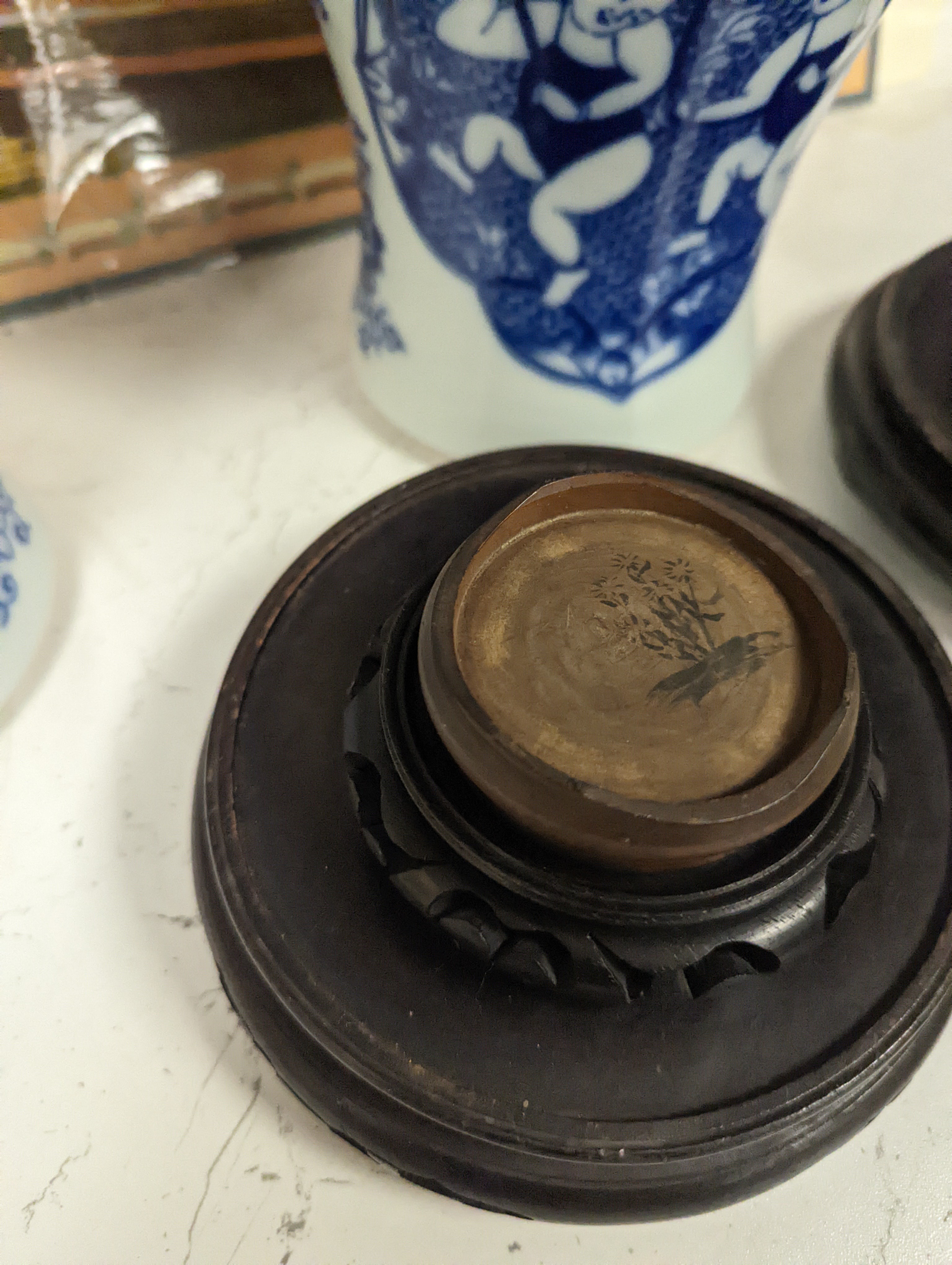 A pair of Chinese blue and white vases on stands and 6 further wood stands. Vases 35cm